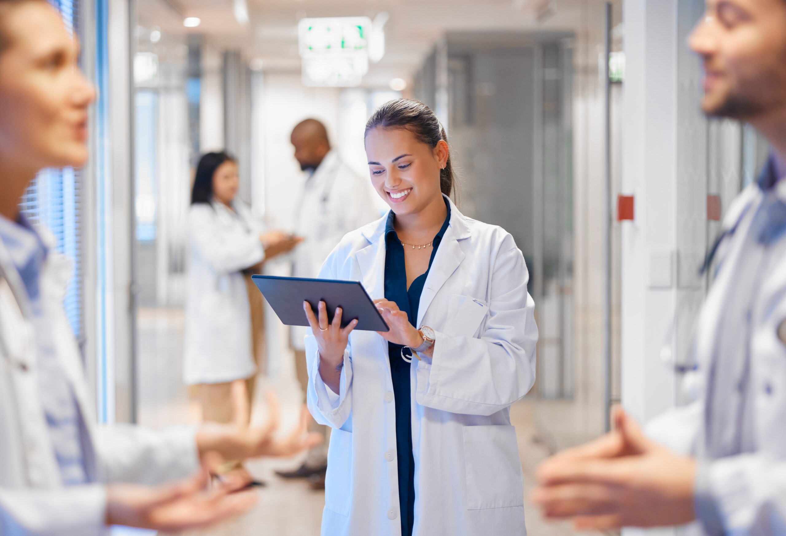 Happy,Woman,Doctor,On,Tablet,For,Employees,Management,,Hospital,Workflow Happy,Woman,Doctor,On,Tablet,For,Employees,Management,,Hospital,Workflow